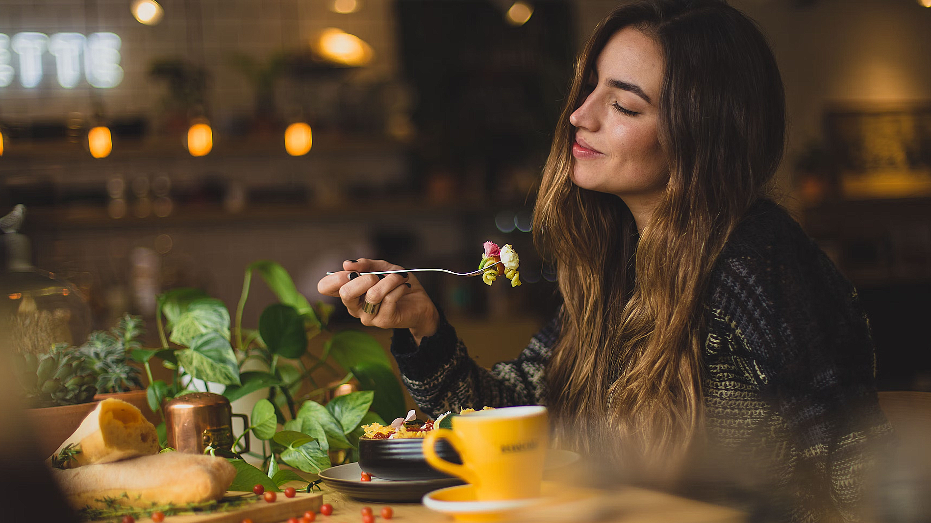 person holding silver fork and knife