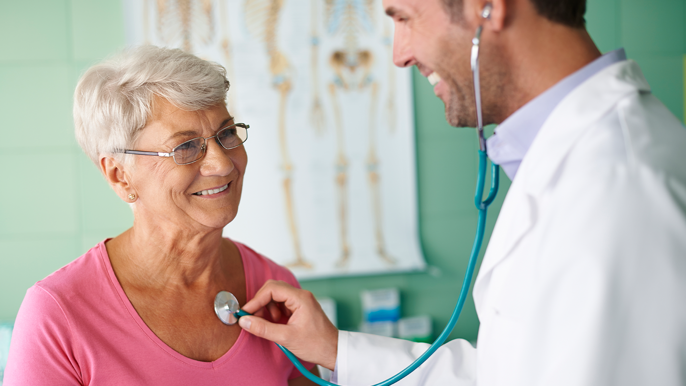 person holding silver fork and knife