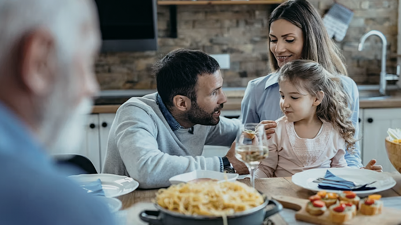 person holding silver fork and knife
